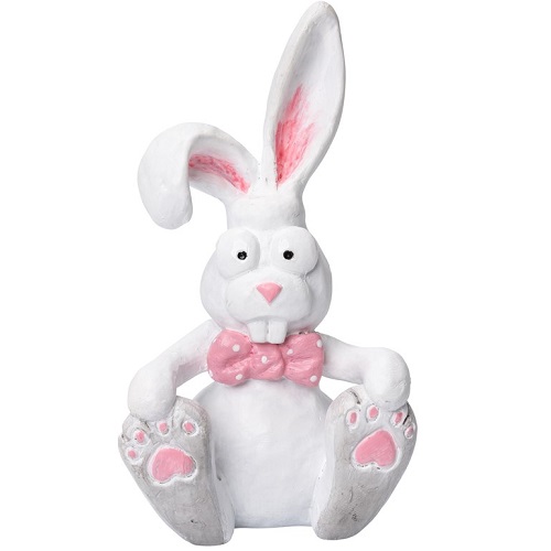 Kaninen Harry sitter och håller i sina är vit tassar. Harry är vit med en rosa fluga. Ena örat står upp och andra örat står ner. Söt liten kanin att placera i hemmet med sina stora ögon.